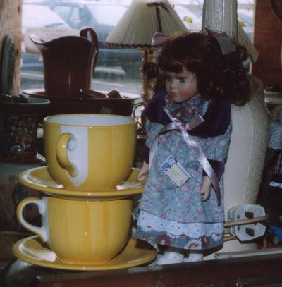 A doll and cups